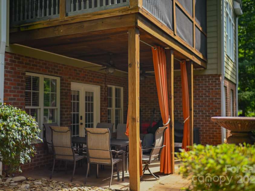 150 William Gilbert Loop, Rutherfordton, NC 28139.  MLS# CAR4282492, YatesRealty ID 28307. Back Covered Patio off of Basement