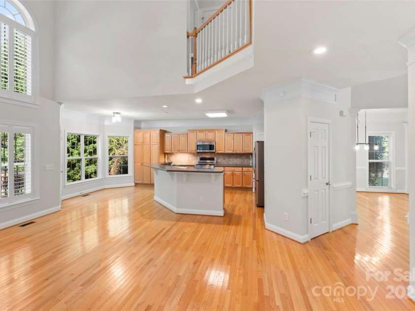 551 Hemmings Place, Concord, NC 28027.  MLS# CAR4244945, YatesRealty ID 28312. Great Room and Kitchen