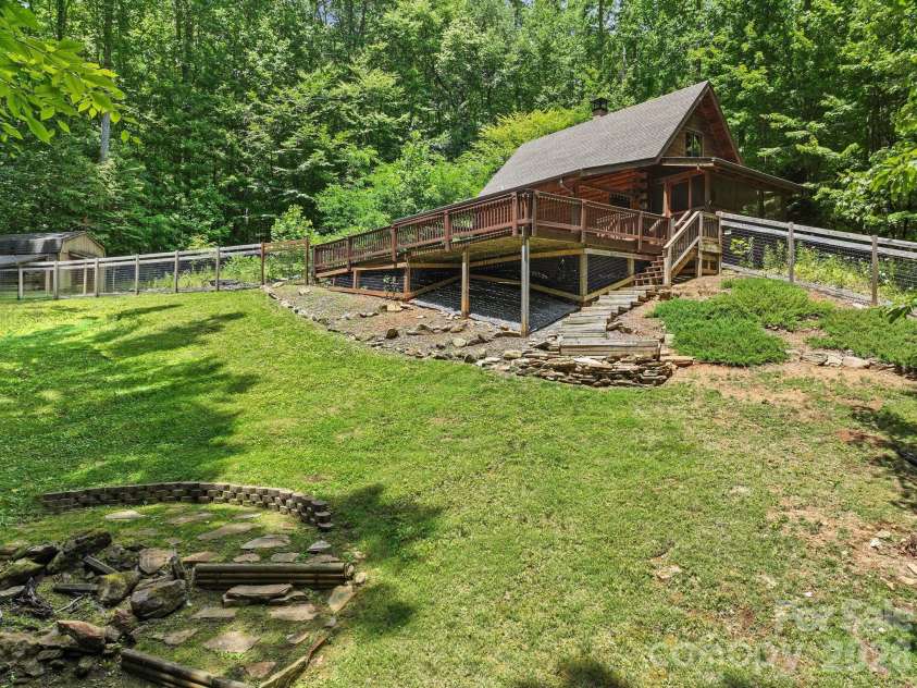 89 Apgar Road, Candler, NC 28715.  MLS# CAR4397603, YatesRealty ID 28314. Stunning yard with firepit