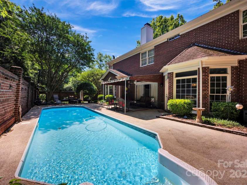 7014 Walton Heath Lane, Charlotte, NC 28277.  MLS# CAR4274206, YatesRealty ID 28318. Another look at the shimmering pool and back of your home!