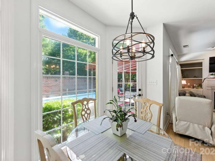 7014 Walton Heath Lane, Charlotte, NC 28277.  MLS# CAR4274206, YatesRealty ID 28318. Imagine having breakfast while gazing out at your shimmering and refreshing in-ground pool! Just step out to your charming outdoor living area!