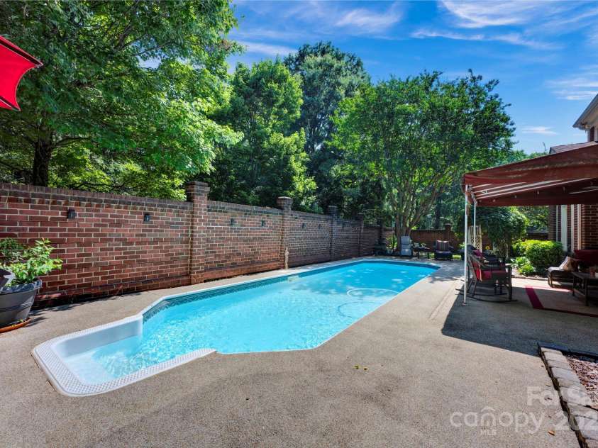 7014 Walton Heath Lane, Charlotte, NC 28277.  MLS# CAR4274206, YatesRealty ID 28318. In addition to everything this home offers you also have an in-ground pool to splash around in!
