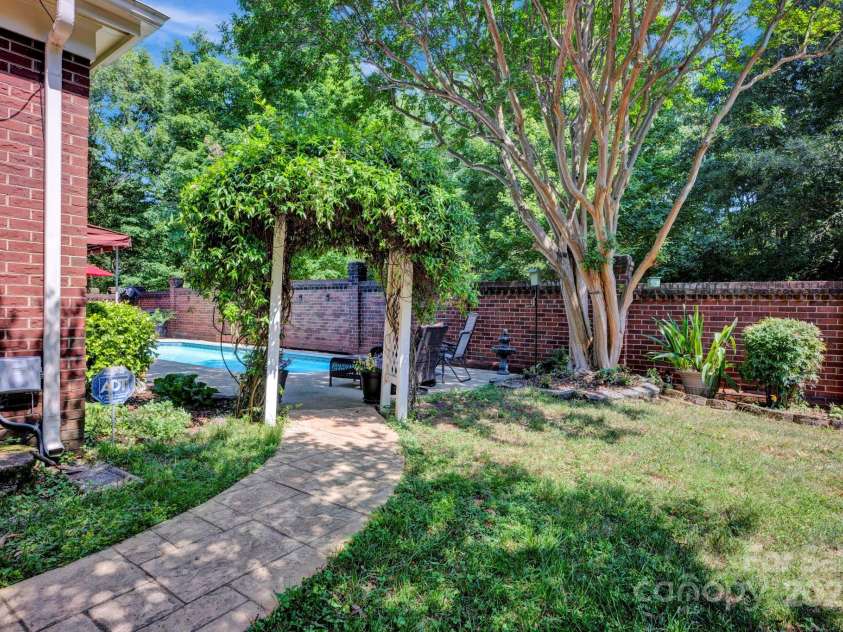 7014 Walton Heath Lane, Charlotte, NC 28277.  MLS# CAR4274206, YatesRealty ID 28318. Let's take a walk back to your outdoor living area for one more look!