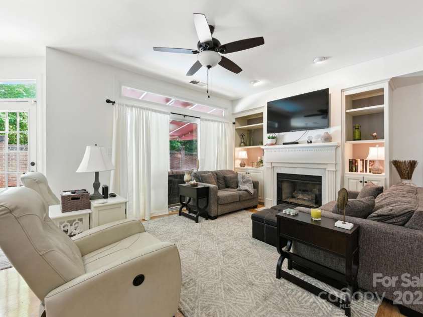 7014 Walton Heath Lane, Charlotte, NC 28277.  MLS# CAR4274206, YatesRealty ID 28318. The Living Room is highlighted by built-ins and a gas fireplace which is always cozy during cool evenings!