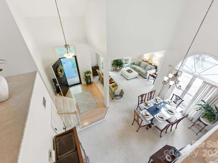 7014 Walton Heath Lane, Charlotte, NC 28277.  MLS# CAR4274206, YatesRealty ID 28318. This light-filled home, with its soaring 2-story entrance, is freshly painted with neutral tones and ceilings are smooth (no popcorn)!