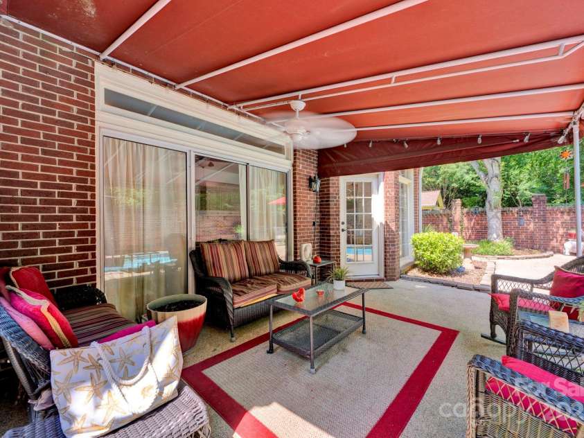7014 Walton Heath Lane, Charlotte, NC 28277.  MLS# CAR4274206, YatesRealty ID 28318. Your covered patio is wonderful when you need a little shade or just want to have some fun conversation with friends!