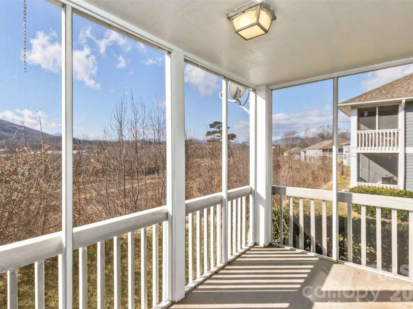 3305 Idle Hour Drive, Asheville, NC 28806.  MLS# CAR4336011, YatesRealty ID 2832. Reading and relaxing