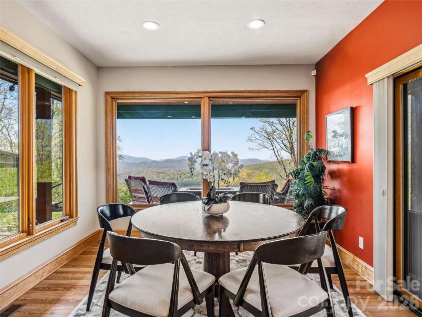 91 Great Oak Lane, Fairview, NC 28730.  MLS# CAR4376722, YatesRealty ID 28334. Dining area opens to the covered deck for easy access to outdoor cooking