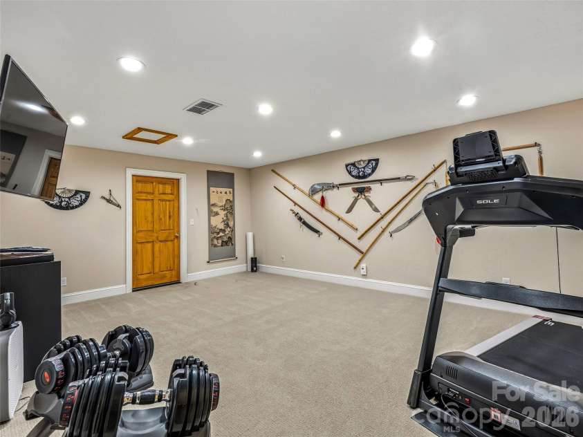 91 Great Oak Lane, Fairview, NC 28730.  MLS# CAR4376722, YatesRealty ID 28334. Downstairs exercise room