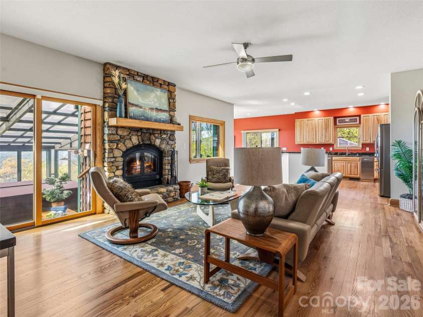 91 Great Oak Lane, Fairview, NC 28730.  MLS# CAR4376722, YatesRealty ID 28334. Great Room open to the enclosed pool & kitchen