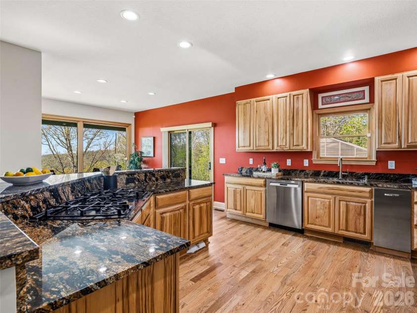 91 Great Oak Lane, Fairview, NC 28730.  MLS# CAR4376722, YatesRealty ID 28334. Kitchen island with gas cooktop
