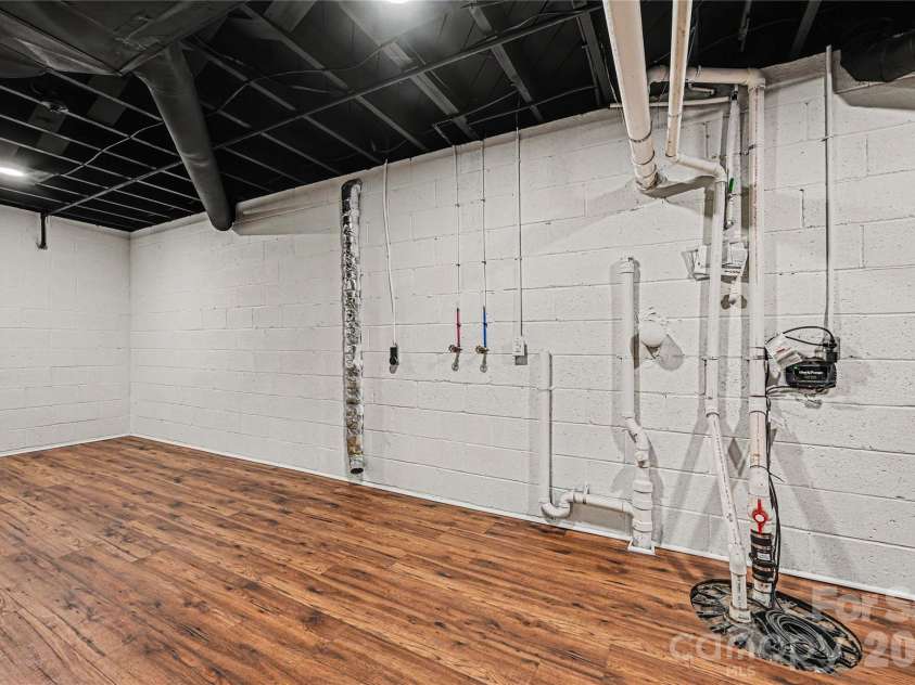 716 Grandview Drive, Concord, NC 28025.  MLS# CAR4390643, YatesRealty ID 28336. Dedicated laundry and utility area conveniently located within the expansive lower level.
