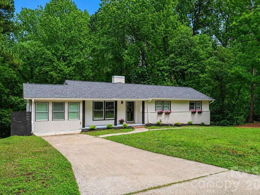 716 Grandview Drive, Concord, NC 28025.  MLS# CAR4390643, YatesRealty ID 28336. Fresh landscaping, mature trees, and a peaceful setting create a beautiful first impression.