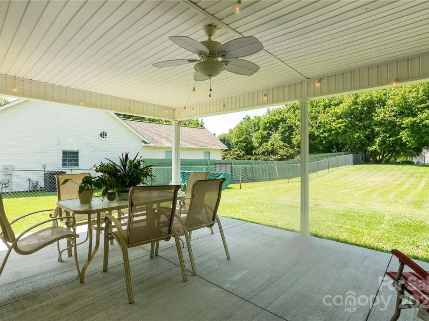 802 Woodlark Court, Fletcher, NC 28732.  MLS# CAR4274029, YatesRealty ID 28336. Large shaded rear patio overlooking expansive yard