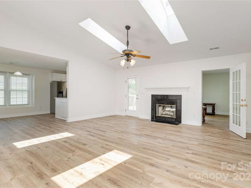 802 Woodlark Court, Fletcher, NC 28732.  MLS# CAR4274029, YatesRealty ID 28336. Living Room flows to Dining Room and Kitchen.