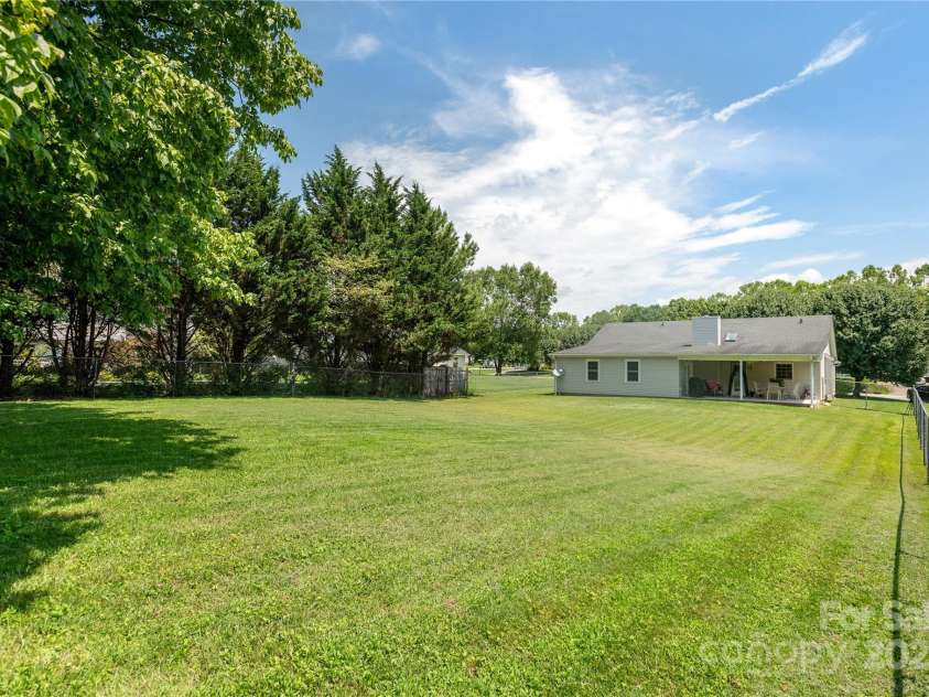 802 Woodlark Court, Fletcher, NC 28732.  MLS# CAR4274029, YatesRealty ID 28336. Look at that level fenced back yard!!
