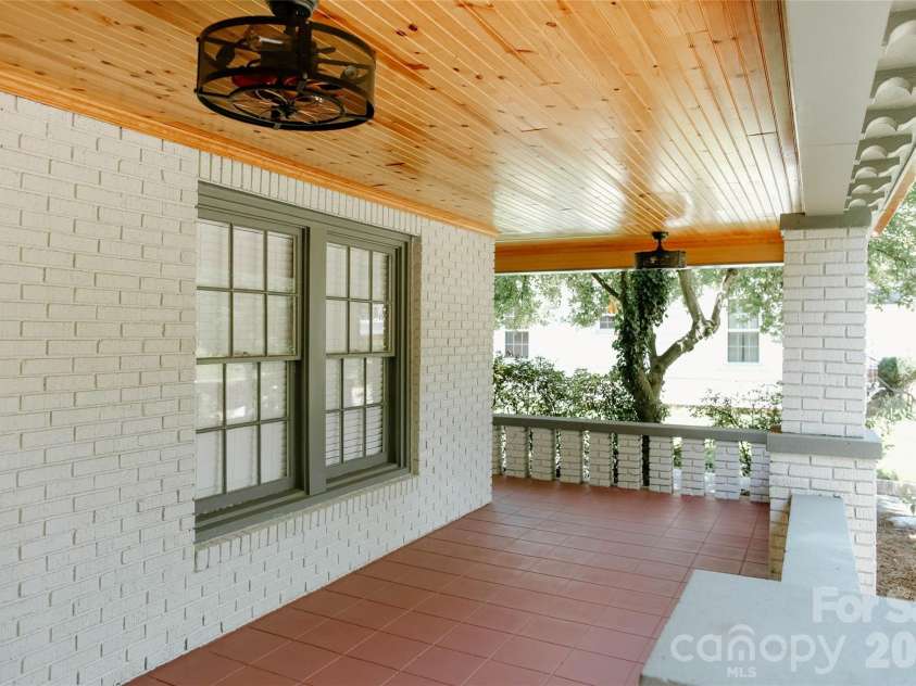 135 Beech Street, Concord, NC 28025.  MLS# CAR4390447, YatesRealty ID 28341. Oversized wraparound covered front porch with stylish ceiling fans