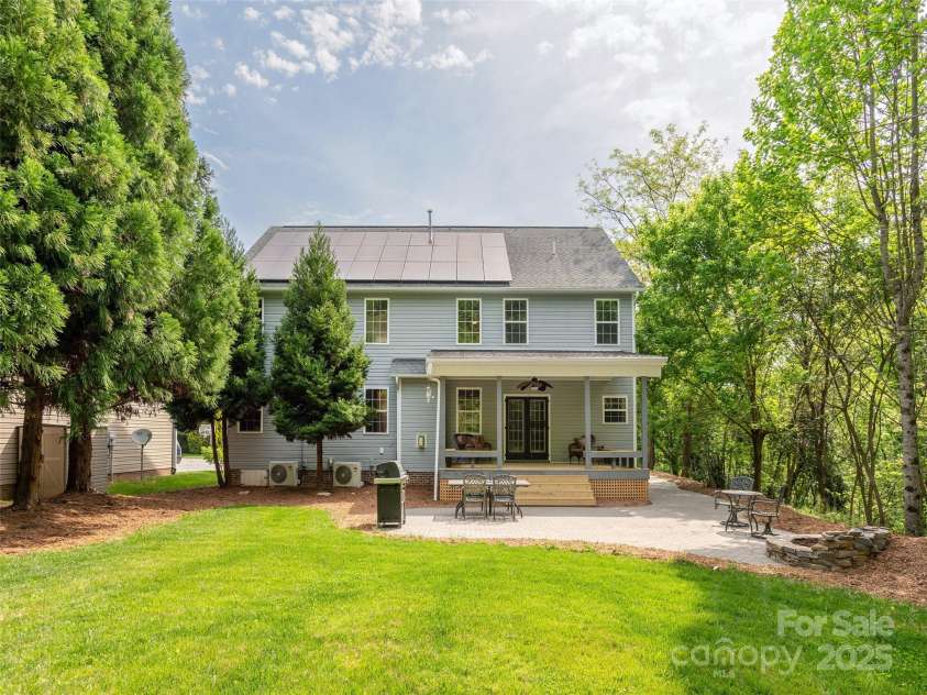 15 Dansford Lane, Arden, NC 28704.  MLS# CAR4255173, YatesRealty ID 28347. A view of the house from the backyard.  Solar panel aren't visible from the front..