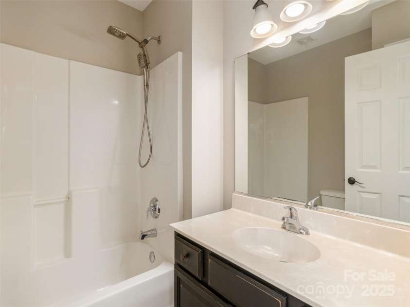 15 Dansford Lane, Arden, NC 28704.  MLS# CAR4255173, YatesRealty ID 28347. Bath #2 on upper level off of Family Room & Bedroom #2