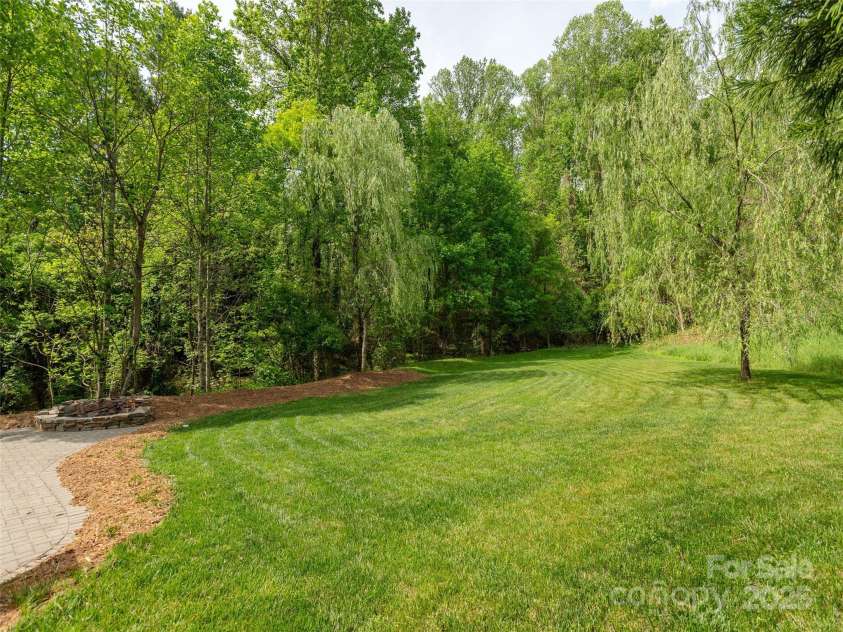 15 Dansford Lane, Arden, NC 28704.  MLS# CAR4255173, YatesRealty ID 28347. Fall in love with your backyard and enjoy the changing seasons