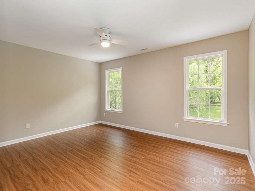 15 Dansford Lane, Arden, NC 28704.  MLS# CAR4255173, YatesRealty ID 28347. Large bedroom #5 on upper level, view of backyard