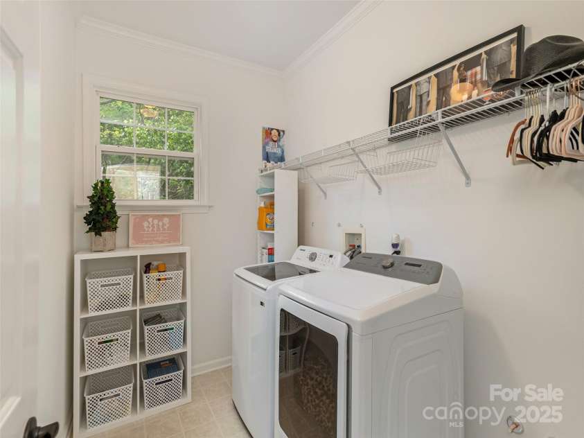 15 Dansford Lane, Arden, NC 28704.  MLS# CAR4255173, YatesRealty ID 28347. Laundry room with space to hang items...washer and dryer comes with the house....