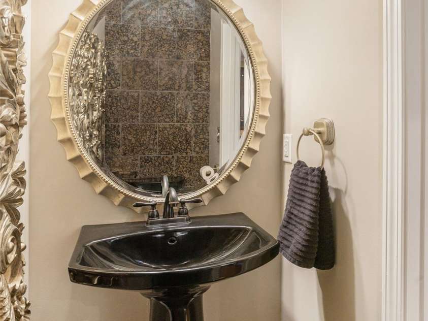 15 Dansford Lane, Arden, NC 28704.  MLS# CAR4255173, YatesRealty ID 28347. Sleek half bath for convenience