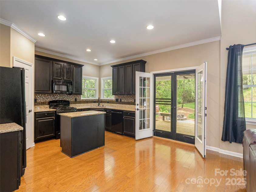 15 Dansford Lane, Arden, NC 28704.  MLS# CAR4255173, YatesRealty ID 28347. Step out onto the covered patio for al fresco dining overlooking your private backyard