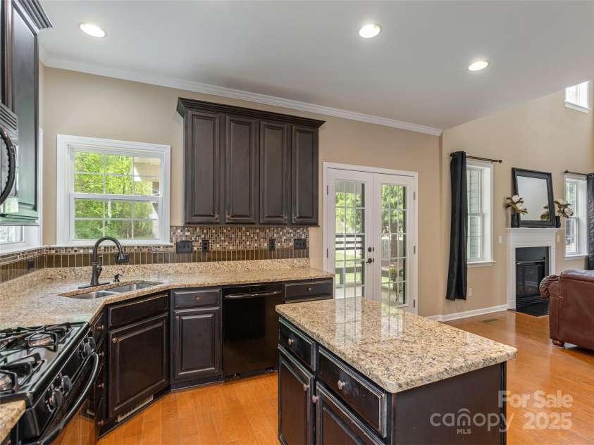 15 Dansford Lane, Arden, NC 28704.  MLS# CAR4255173, YatesRealty ID 28347. We all know that everyone gathers in the kitchen..so this way no one is excluded