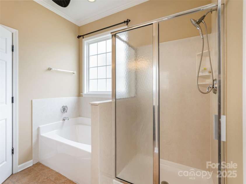 15 Dansford Lane, Arden, NC 28704.  MLS# CAR4255173, YatesRealty ID 28347. Why choose between shower and bath when you can have both....