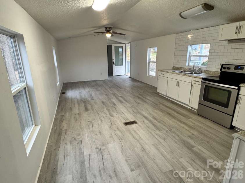 111 Cloverleaf Drive, Clover, SC 29710.  MLS# CAR4334893, YatesRealty ID 2835. Kitchen, dining and living room area