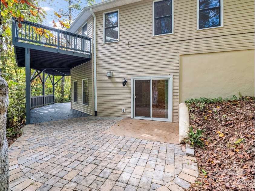 204 Pine Berry Circle, Hendersonville, NC 28739.  MLS# CAR4309907, YatesRealty ID 28353. Lower level family room leads to patio and porch overlooking the creek