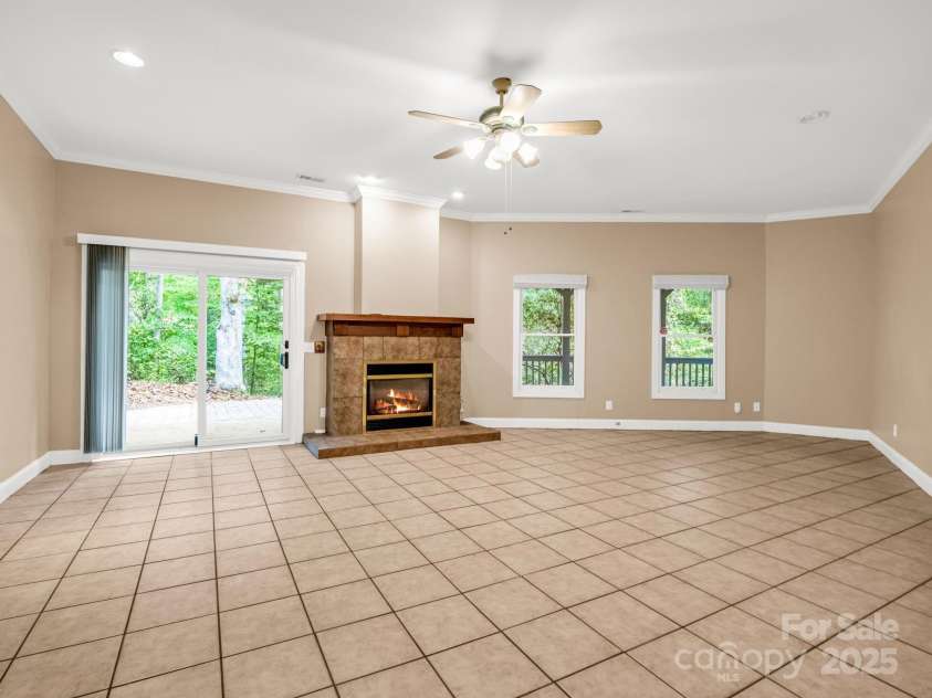 204 Pine Berry Circle, Hendersonville, NC 28739.  MLS# CAR4309907, YatesRealty ID 28353. Lower-level family room opens to patio