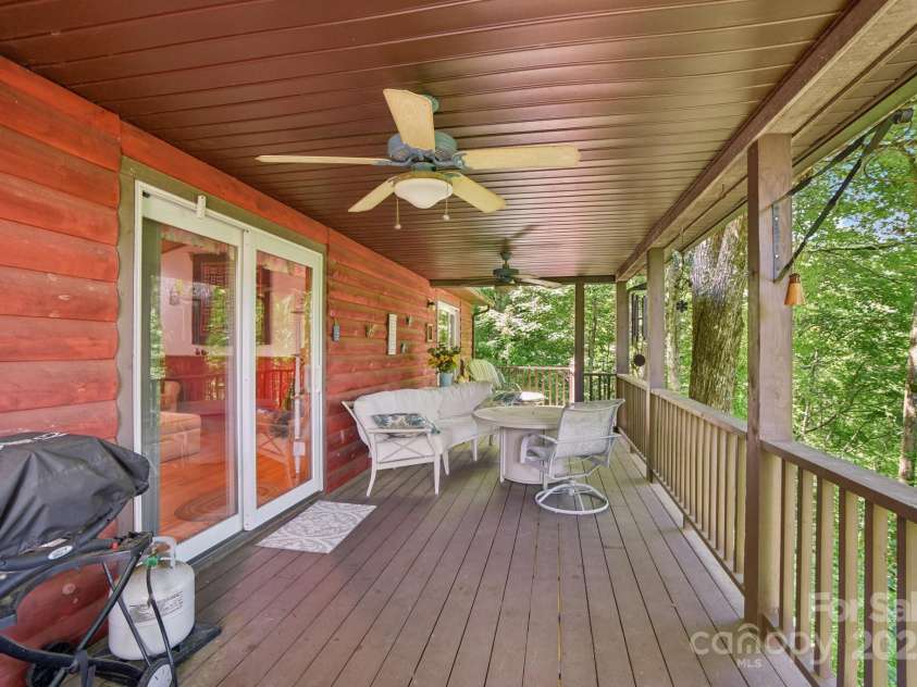 1158 Plott Balsam Road, Maggie Valley, NC 28751.  MLS# CAR4277695, YatesRealty ID 28355. Outside the living room. This massive 2 level deck has 4 separate seating areas perfect for entertaining 