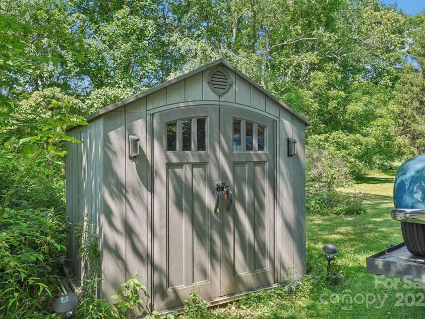 25 Hazel Court, Brevard, NC 28712.  MLS# CAR4277824, YatesRealty ID 28358. The perfect storage shed for all your tools and treasures