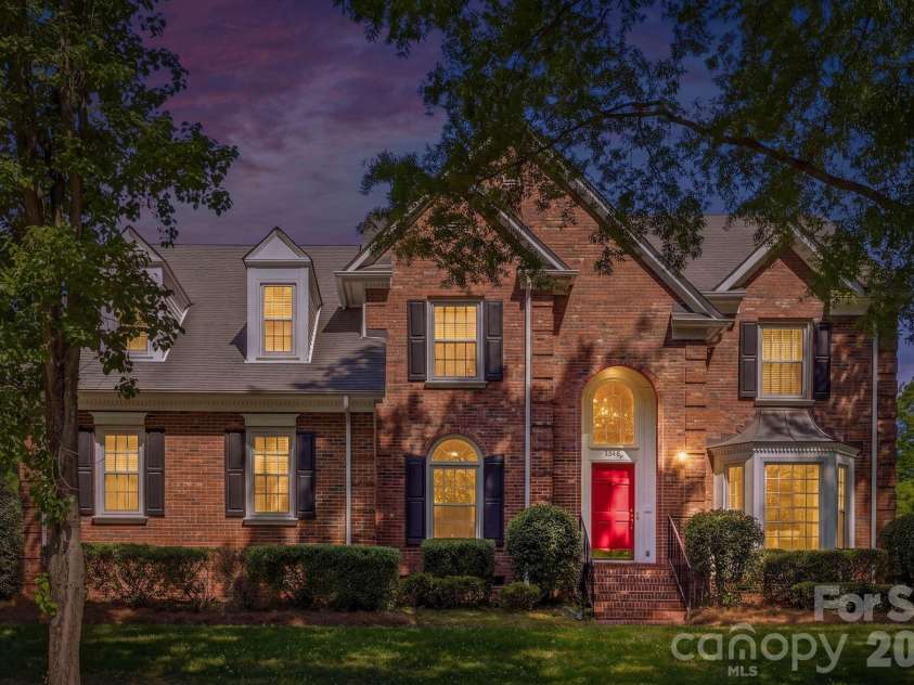 7006 Darnley Place, Charlotte, NC 28226.  MLS# CAR4367074, YatesRealty ID 28363. Front Exterior Twilight