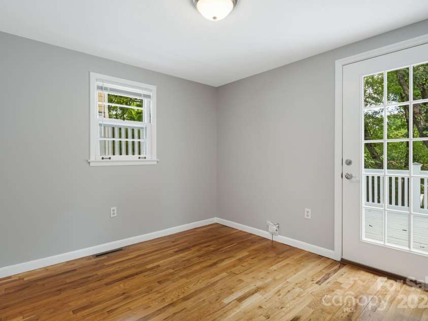 82 Maney Avenue, Asheville, NC 28804.  MLS# CAR4285420, YatesRealty ID 28365. Guest bedroom #2. Opens up to the back deck. Maybe an office?