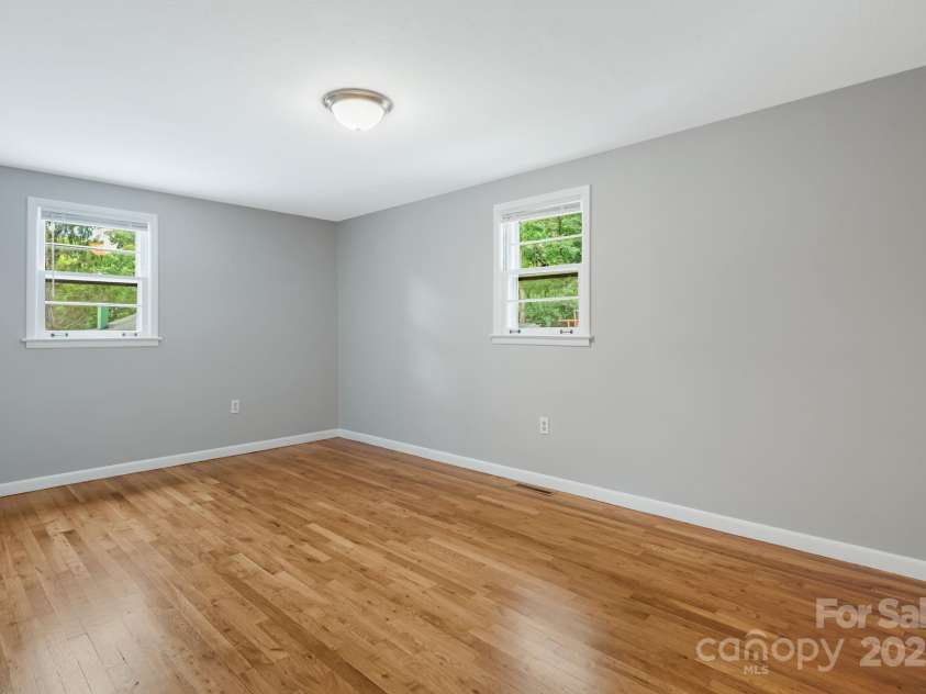 82 Maney Avenue, Asheville, NC 28804.  MLS# CAR4285420, YatesRealty ID 28365. Primary bedroom. Beautiful hardwoods/new paint!