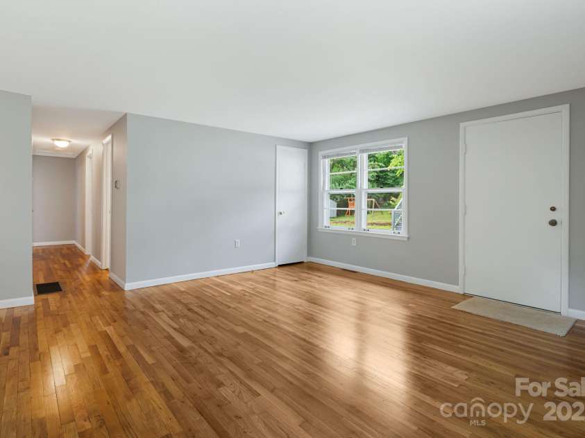 82 Maney Avenue, Asheville, NC 28804.  MLS# CAR4285420, YatesRealty ID 28365. Refinished oak hardwoods and new interior paint.