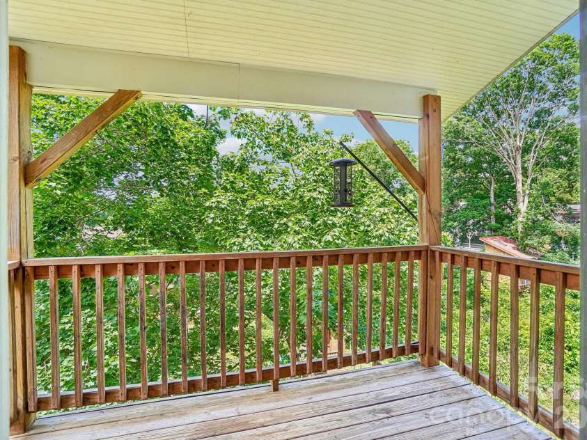 25 Houston Street, Asheville, NC 28801.  MLS# CAR4385801, YatesRealty ID 28369. Serene deck space main level. Surrounded by greenery