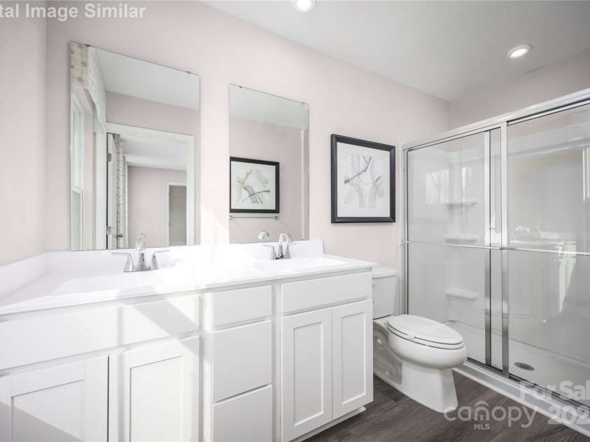 1813 Millstream Drive, China Grove, NC 28023.  MLS# CAR4248118, YatesRealty ID 28373. Owner's Bath with Ceramic Dual Sinks and Large Walk-in Shower