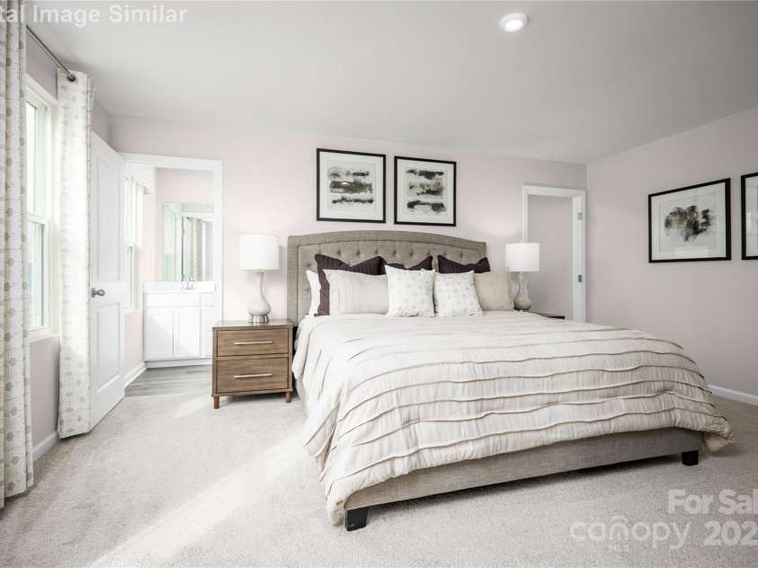 1813 Millstream Drive, China Grove, NC 28023.  MLS# CAR4248118, YatesRealty ID 28373. The Luxurious Owner's Suite is a Serene Retreat, complete with a Spa-like Bath featuring a Double Vanity.