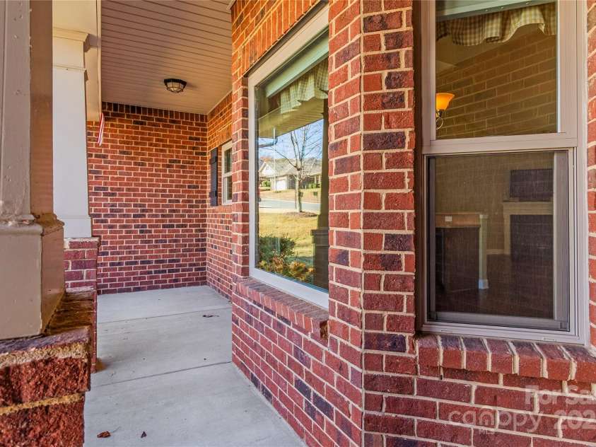 7208 Ogden Place, Denver, NC 28037.  MLS# CAR4318593, YatesRealty ID 2838. Rocking Chair Porch