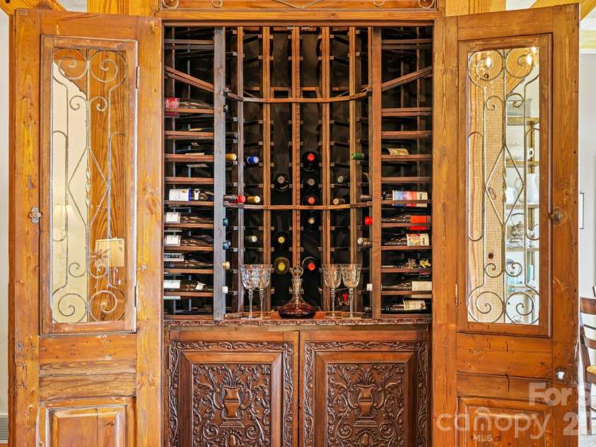 1052 Toxaway Drive, Lake Toxaway, NC 28747.  MLS# CAR4371688, YatesRealty ID 28382. Statement Wine Feature