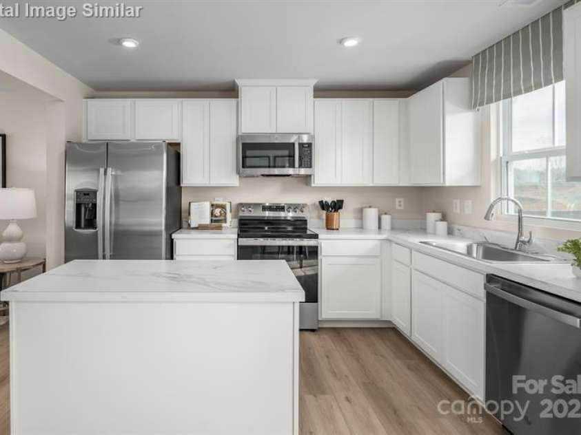 5742 Knox Lane, Kannapolis, NC 28081.  MLS# CAR4278228, YatesRealty ID 28383. Enjoy the clean lines and generous storage of 36-inch cabinetry in this beautifully appointed kitchen