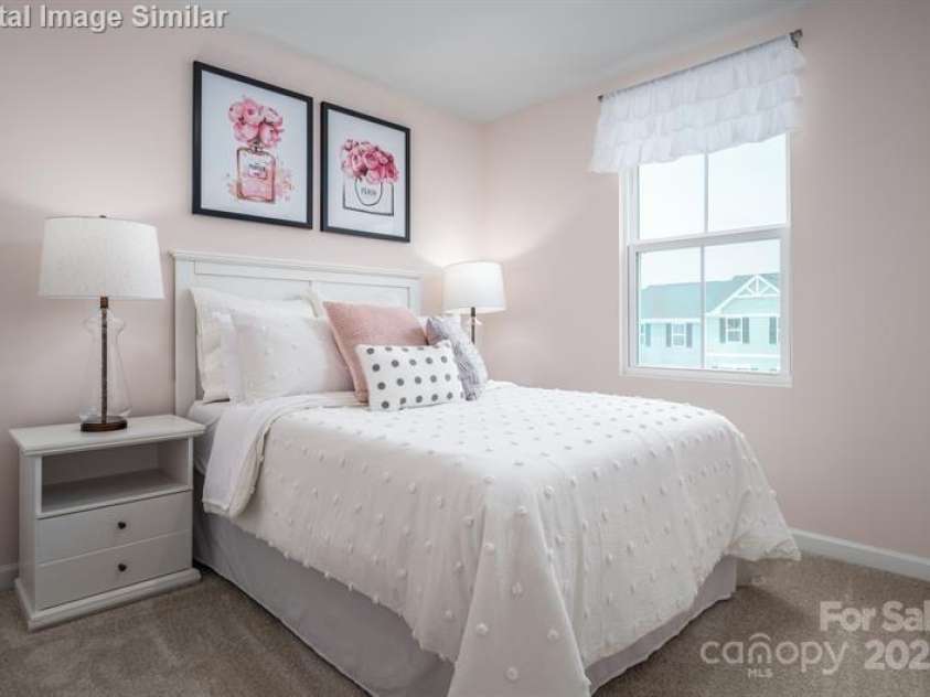 5742 Knox Lane, Kannapolis, NC 28081.  MLS# CAR4278228, YatesRealty ID 28383. This adorable bedroom is a dream come true for any little girl — warm, inviting, and full of personality.