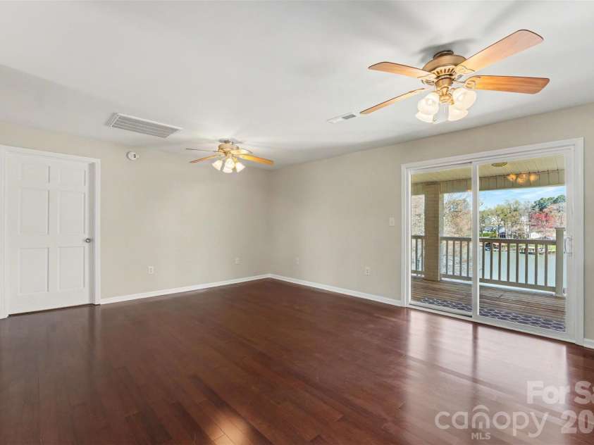 7088 Wateredge Drive, Sherrills Ford, NC 28673.  MLS# CAR4319467, YatesRealty ID 28384. Dining Area with exit to deck overlooking water