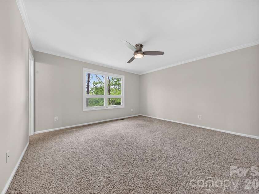 16118 Tana Tea Circle, Tega Cay, SC 29708.  MLS# CAR4368051, YatesRealty ID 28390. First Floor Primary Suite