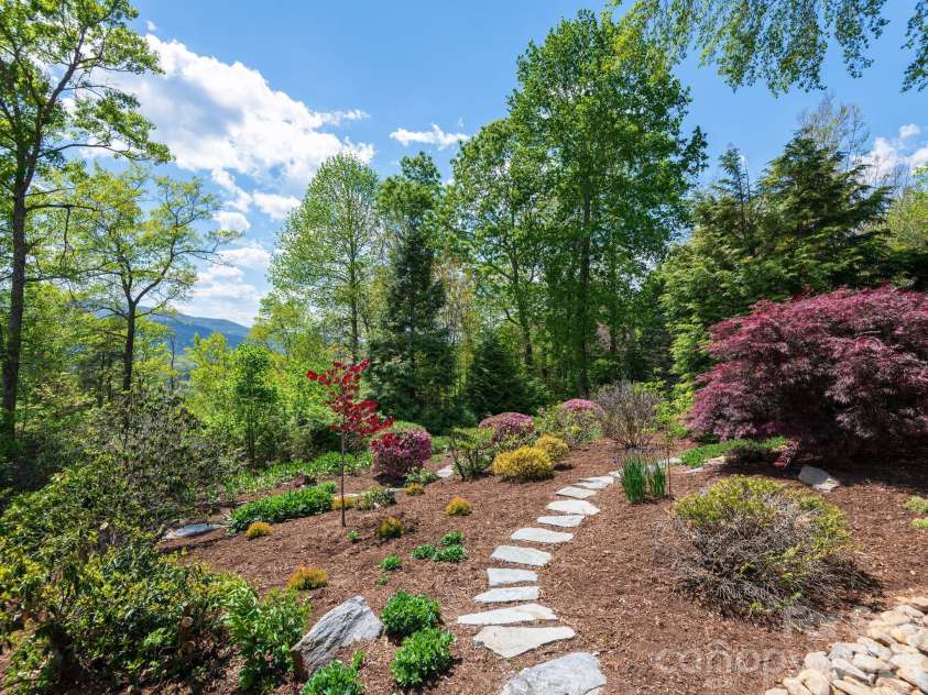 43 Galax Lane, Black Mountain, NC 28711.  MLS# CAR4355417, YatesRealty ID 28393. Stone pathways invite you to slow down and explore.