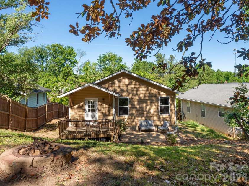 24 Hilldale Road, Asheville, NC 28803.  MLS# CAR4382558, YatesRealty ID 28400. Fire pit in backyard